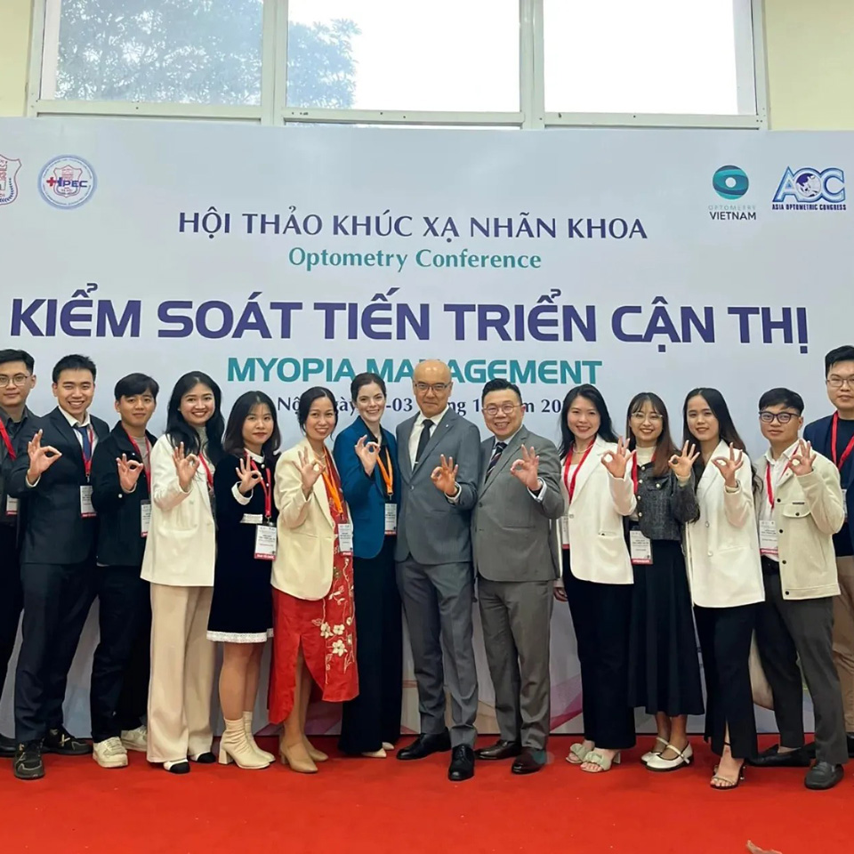 A group photo, including optometrist Fiona Buckmaster at centre in blue jacket, at Vietnam’s first myopia management conference.