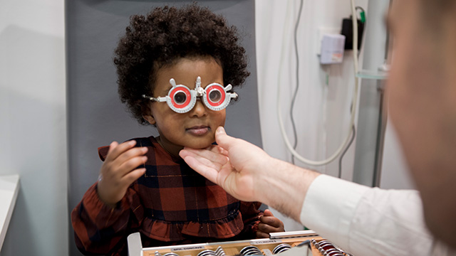 Girl having eye test 