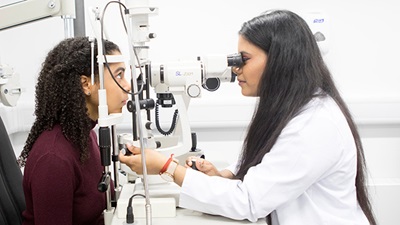 Optometrist performing an eye test