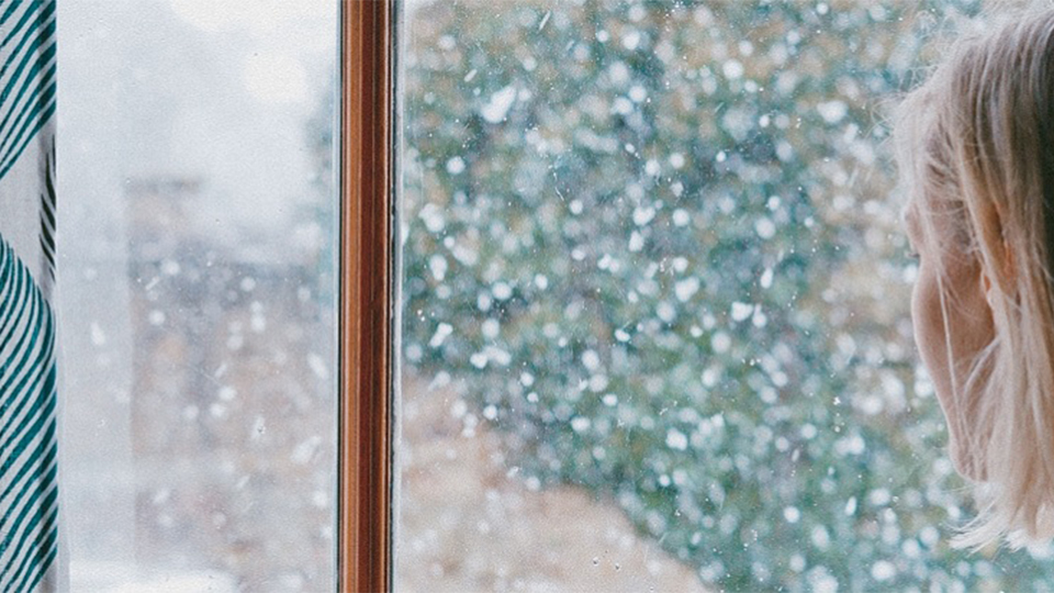 A woman looking out of the window