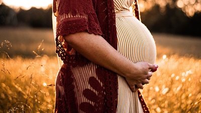 A pregnant woman in the field
