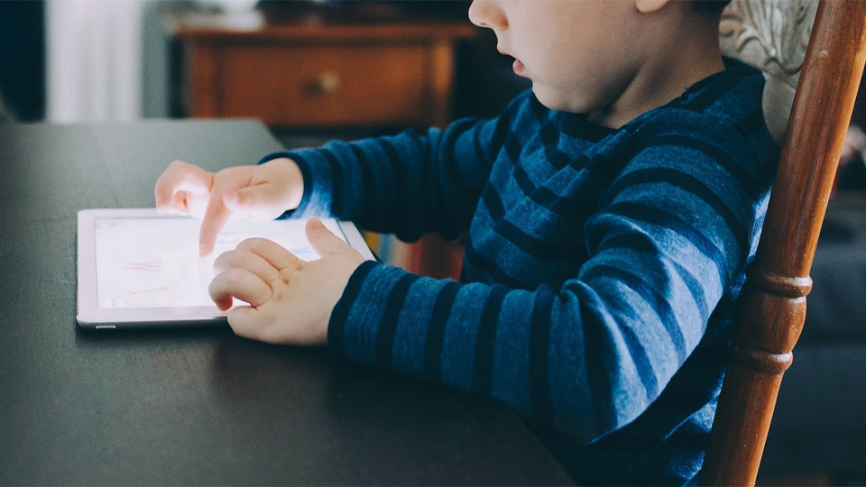 Boy looking at a digital screen