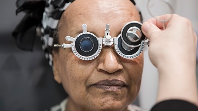elderly woman having eye test