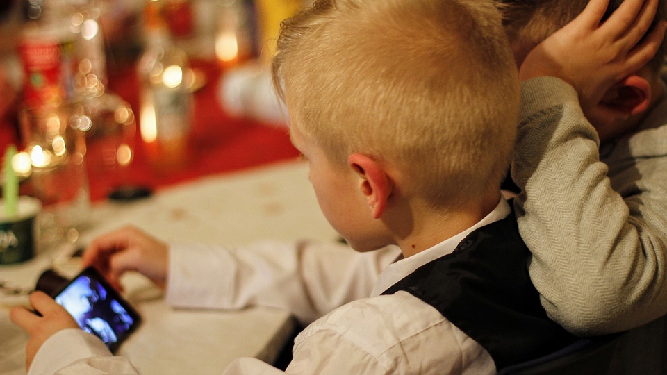 Children looking at a mobile screen