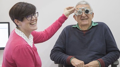 Elderly man with optometrist