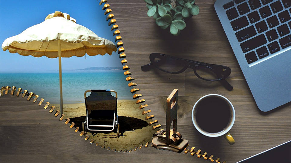 Umbrella, deckchair, sunglasses and a laptop