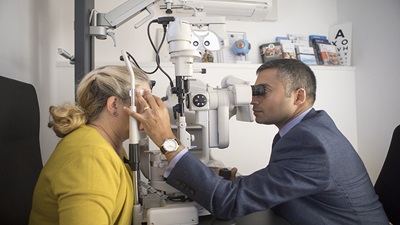 Optometrist carrying out an eye test
