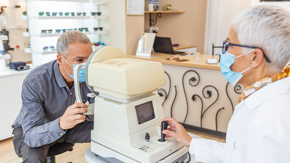 Optometrist examining patients eyes