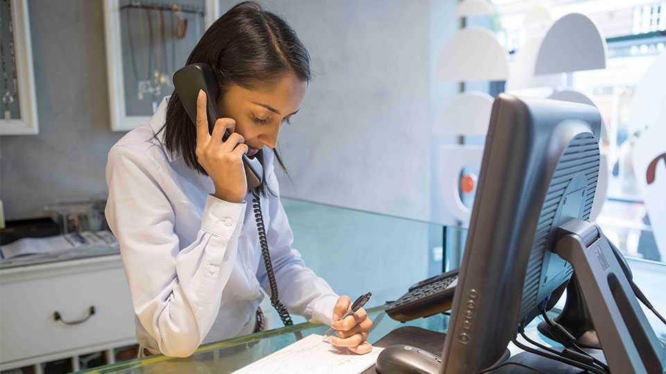 Optometrist working on computer