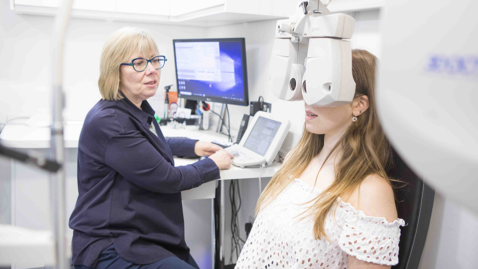 Optometrist with patient