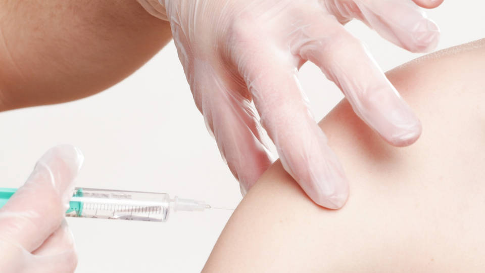 A vaccination being administered