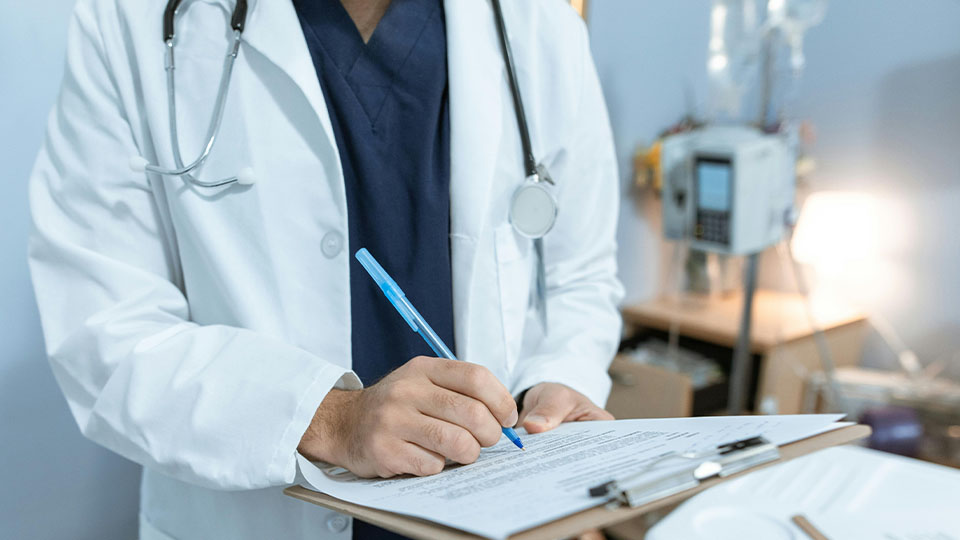 Doctor writing medical notes