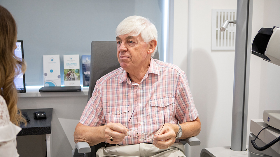 Elderly man having an eye test