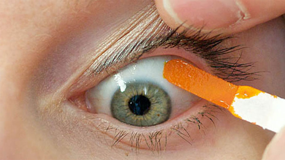Fluorescein-impregnated strip on eye