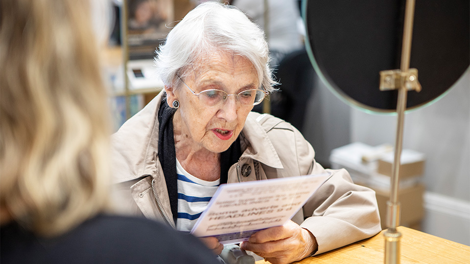 An elderly lady having an eye test