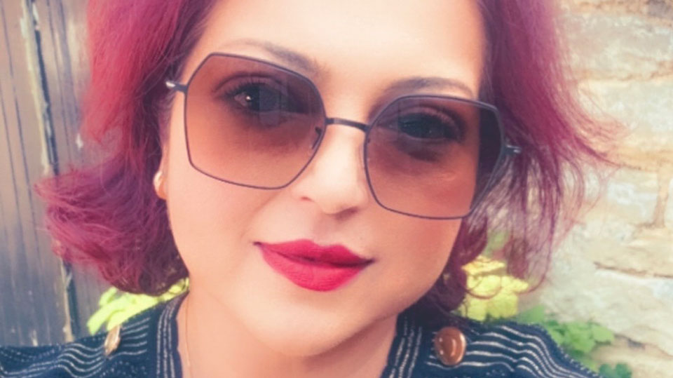  Aziza in large sunglasses on a sunny day