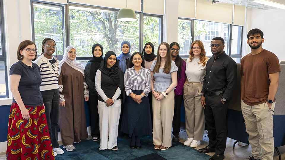 A group of student representatives gather in the AOP offices