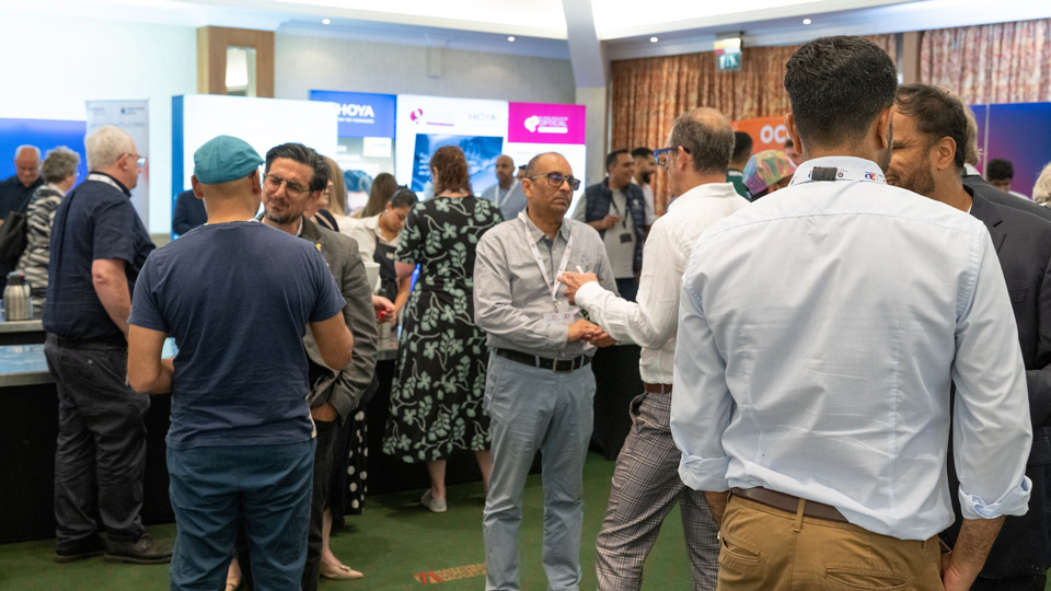 A crowd gathers in an exhibition space