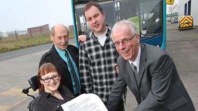 Arriva representatives with RNIB campaigners signing the RNIB's bus charter