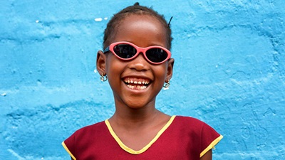 A young girl wearing glasses