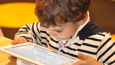 A child using a tablet device