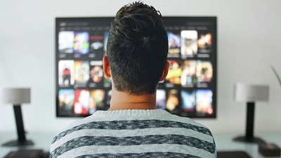 Man in front of TV