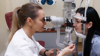 optometrist with patient