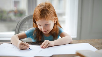 young girl drawing