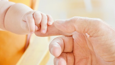 baby and adult hand