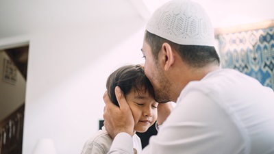 Muslim man and child