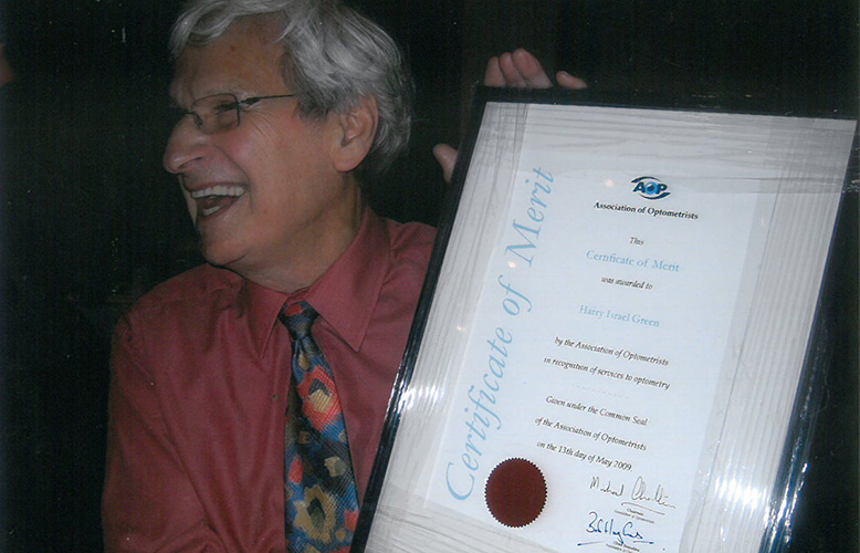 AOP lifetime member, Harry Green, receives his certificate of merit