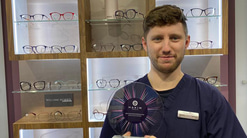 Henry Evans holding Hakim Group award