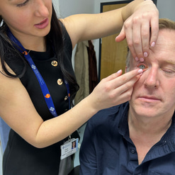 Emily performs a fit check with a contact lens patient