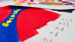 Many sheets of sketchbook paper with designs, plans for colours and notes
