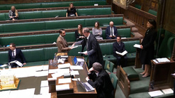 Shockat Adam hands over the copy of his Glaucoma Care: England Bill in the House of Commons chamber