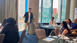 John White presents to tables of optometrists