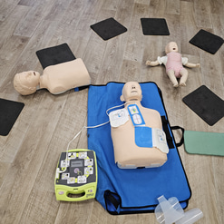 Multiple CR training models, for an infant, child, and adult, are laid out  