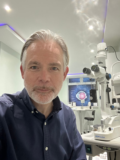 Stuart Humfrey takes a selfie in the consulting room of his practice