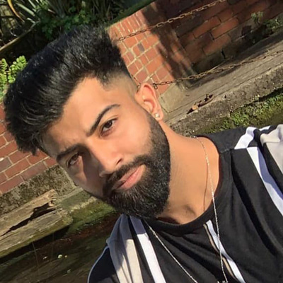 Shahroz wears a black and white t-shirt
