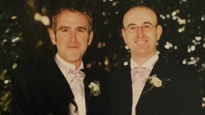 Ian, right, on his wedding day, on his right is his close friend, Noggins. Both wear black wedding suits with lavender cravats and white floral buttonholes