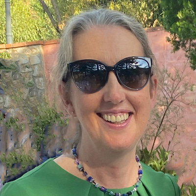 Elaine smiling wearing one of her favourite Maui Jim sunglasses