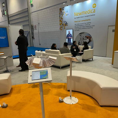 A photo snapped of the NewMedica stand at 100% Optical 2023