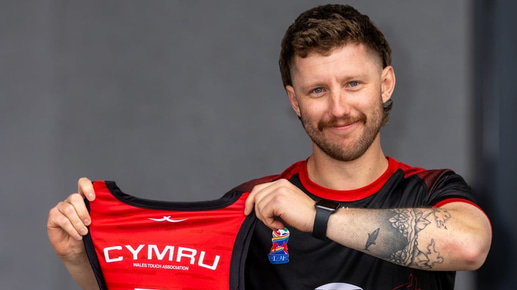 Henry Evans holding rugby shirt