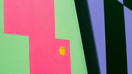 Close-up of a painting wth a pink zigzag with a blob of yellow paint, surrounded by green, and a black and purple square pattern