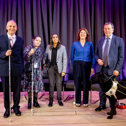 The panel standing on stage at the Braille 200 British Library event