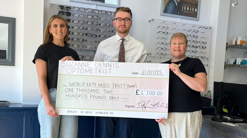 Joe Higham and Kelly Reed present fund raising check