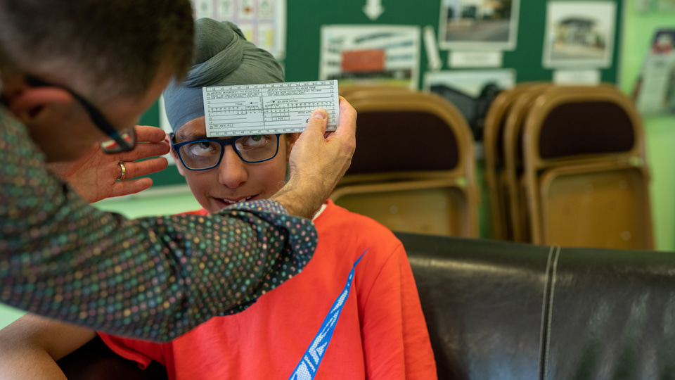 Jodie having spectacle measurements taken