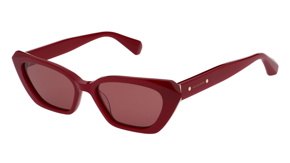 A thin cat’s eye sunglasses frame in a deep red