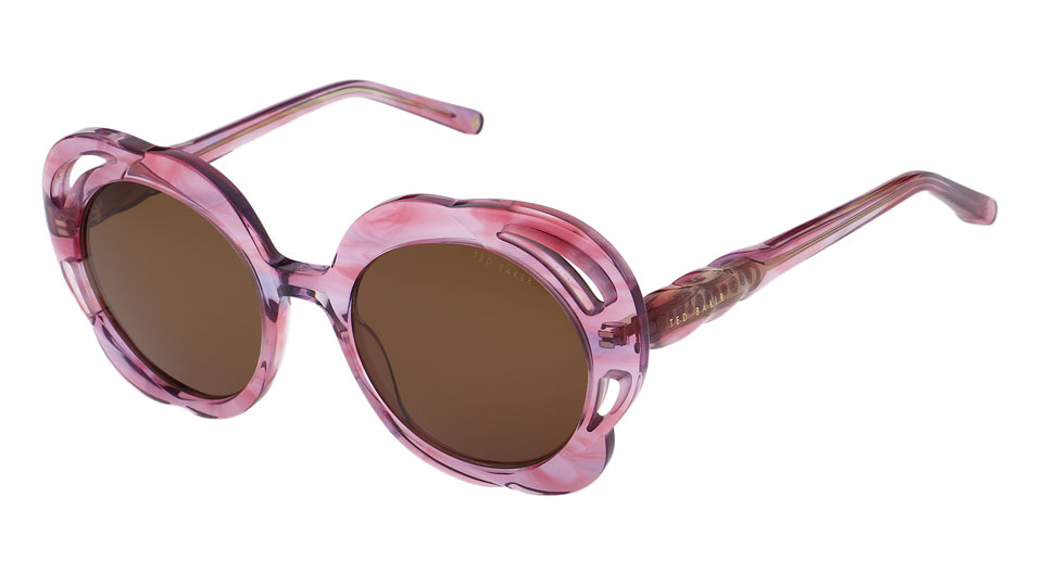 An oversized pink frame shaped like the petals of a flower in a mixed acetate of light and dark pink