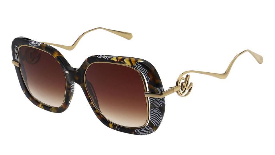 Oversized sunglasses with an absract pattern around the front and fine metal arms that twist, turn and swirl into the CL logo 